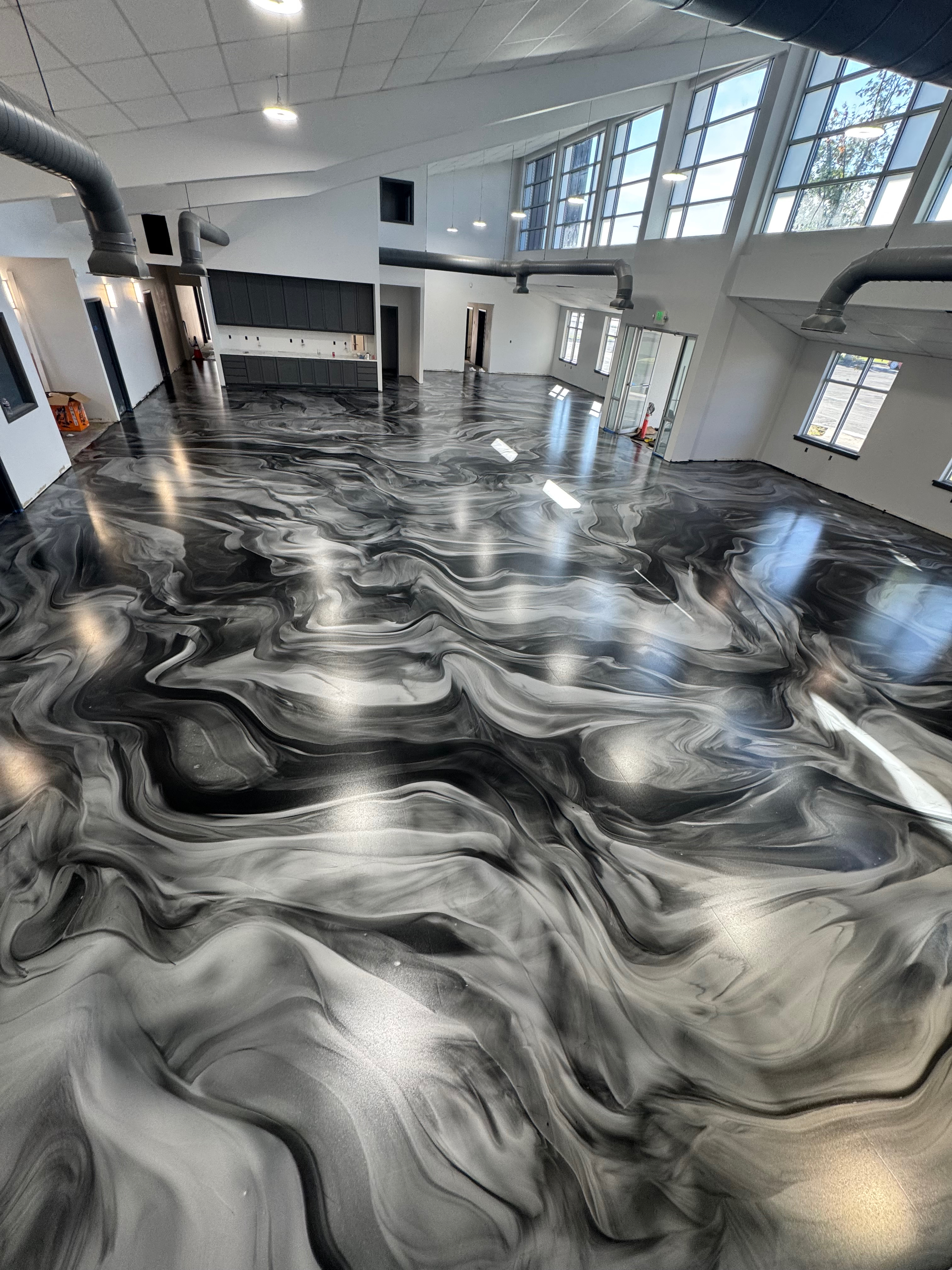 Commercial showroom floor - black and white metallic epoxy